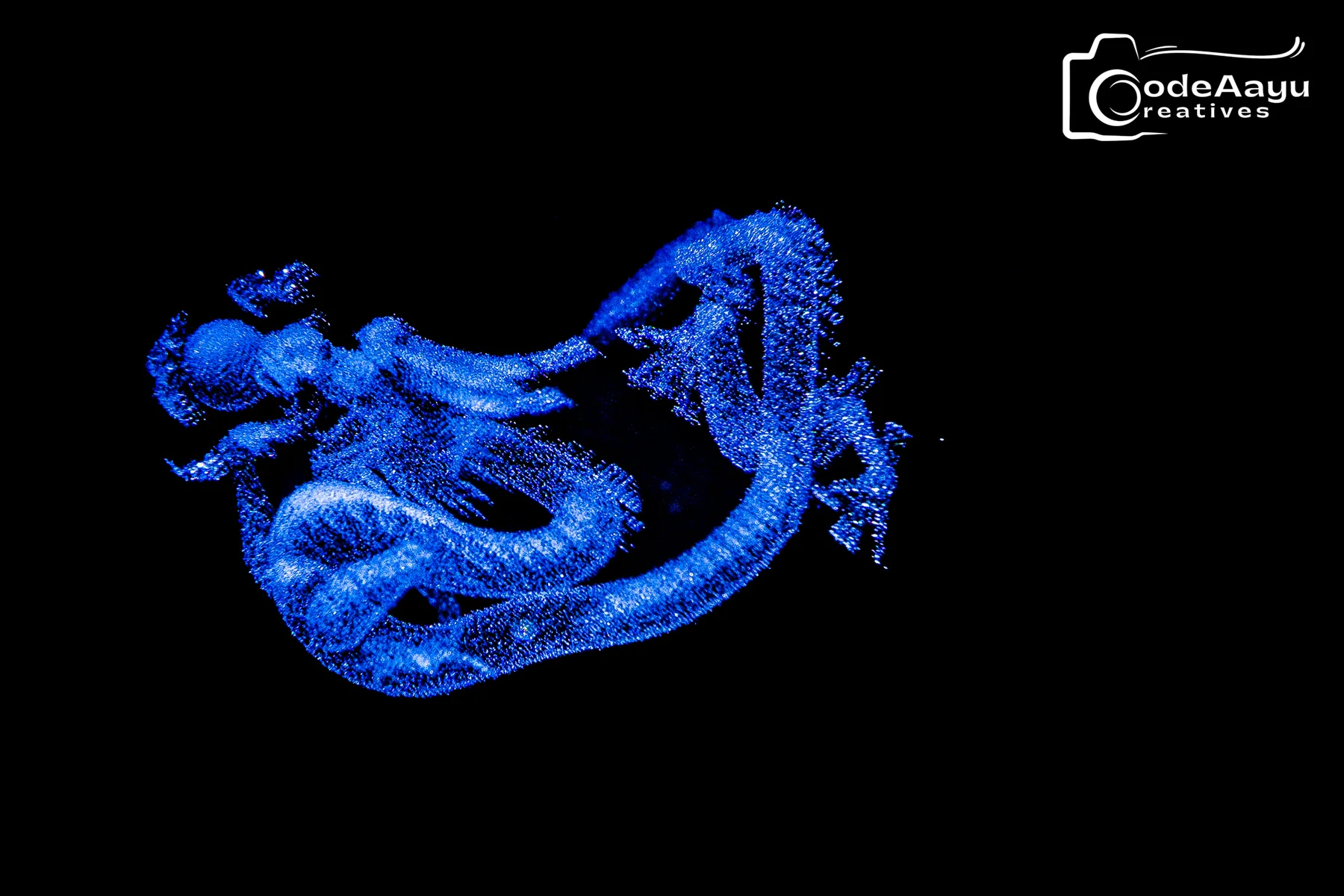 Electric blue glass dragon against a dark background