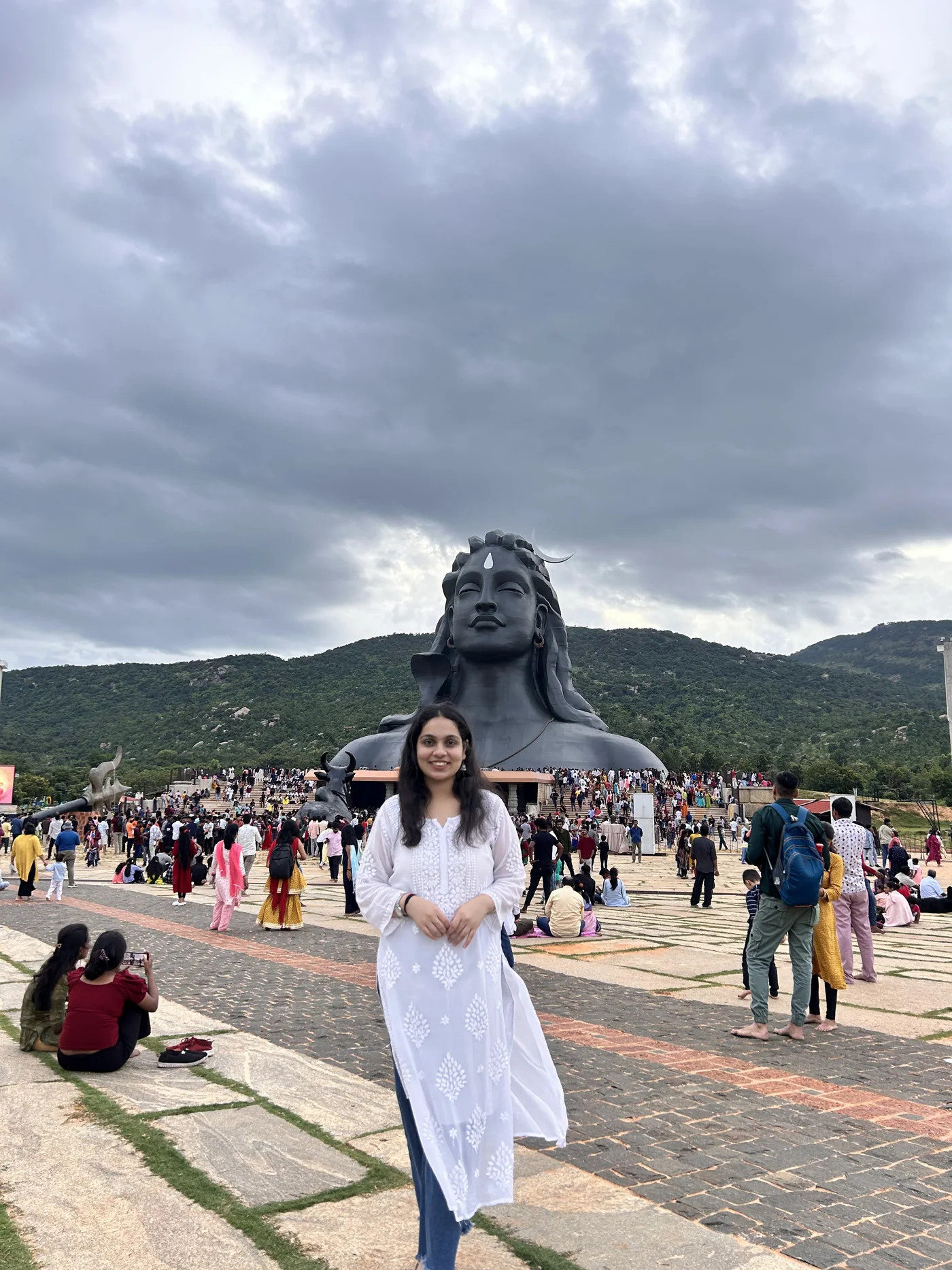 Charvi smiling beneath the Adiyogi statue