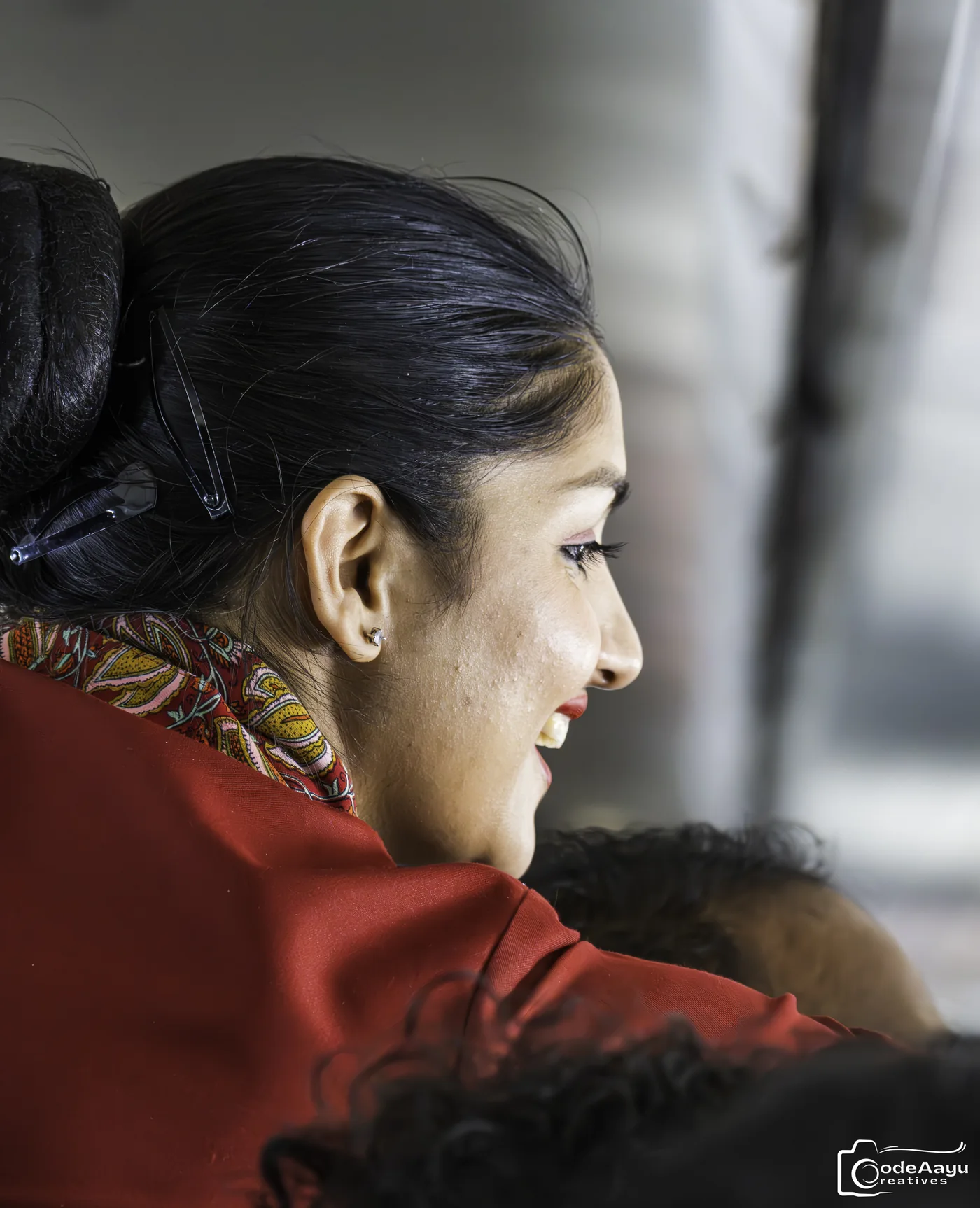 Profile portrait in warm window light